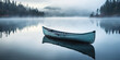 The canoe lies still on the lake glassy surface, cradled by the fog ethereal caress