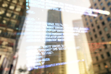 Wall Mural - double exposure of abstract programming language interface on modern skyscrapers background, researc