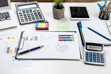 Poster - business graph documents and calculator, supplies on office desk table