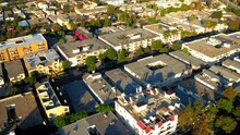 Aerial Forward Shot Of Rooftops Of Residential Buildings Seen From Drone On Sunny Day - Culver City, California