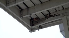 Damaged Support Beams On A Wooden Deck In Need Of Repair