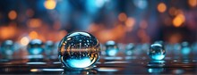 A Glass Ball With A Reflection Of A Blurred City Lights In It On A Reflective Surface With A Blurry Background