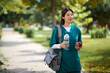 © DragonImages - Student of medical college student walking around campus looking for place to eat snacks