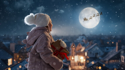 Wall Mural - girl with present at Christmas