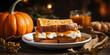 Plate holding pumpkin sandwiches with whipped cream