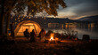 © Keitma - Caucasian family camping in a forest next to a lake at night with tent and campfire