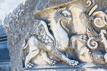 Wall Mural - Griffin sculptures, winged mythical creature at Didyma Apollo temple (Didimeion). Marble relief. Didim (Aydin), Turkey (Turkiye)