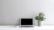 © Oksana_Latysheva - Laptop computer with blank screen on desk in modern home or office interior mock up