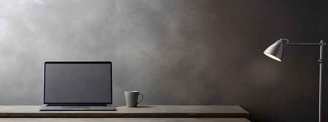 Laptop computer with blank screen on desk in modern home or office interior mock up