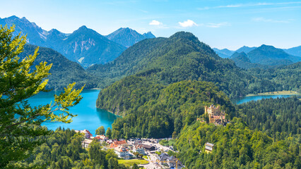 Aerial view  of a mountain valley in south Bavaria, Germany, with the famous medieval castle named 