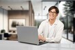 © BillionPhotos.com - Confident smiling man using laptop, AI generated image