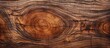 The abstract pattern on the hardwood plank mimics the texture of tree bark creating a captivating background for the portrait of a plant with intricate details and a striking resemblance to