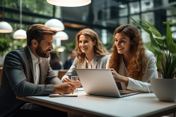 Aufkleber - Design professionals using a laptop together in an office.