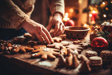 Close Up Of Female Hands Decorating Christmas Gingerbread Cookies