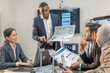 © BESTIMAGE - Manager Motivational teamwork officer by present document to colleagues decide. multiethnic coworker coach explain Analysis Statistics Report drawing presentation to business improvement teamwork