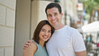 © Krakenimages.com - Beautiful couple smiling confident hugging each other at street