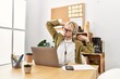 © Krakenimages.com - Young blonde woman business worker agent tired stretching back at office