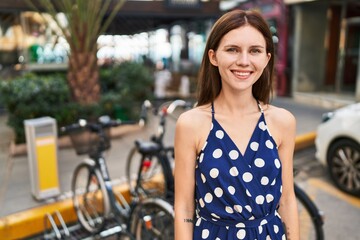 Canvas Print - Young blonde woman smiling confident standing at park