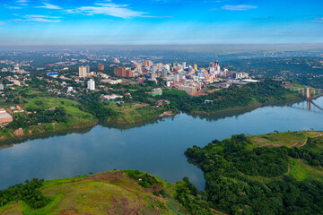 Wall Mural - Aerial view of the Paraguayan city of Ciudad del Este and Friendship Bridge, connecting Paraguay and Brazil through the border over the Parana River,.