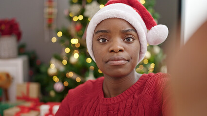 Poster - African american woman celebrating christmas taking selfie picture at home