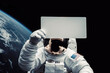 © Jürgen Fälchle - Astronaut in outer space holding a blank sign in his hand