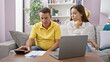 © Krakenimages.com - Father and daughter bonding over family accounting session on the sofa at home