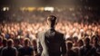 © CStock - Rear view of Motivational speaker with on stage, blurred audience,meeting of many people