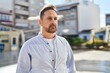 © Krakenimages.com - Young caucasian man looking to the side with serious expression at street