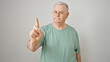 Middle age grey-haired man standing with serious expression saying no with finger over isolated white background
