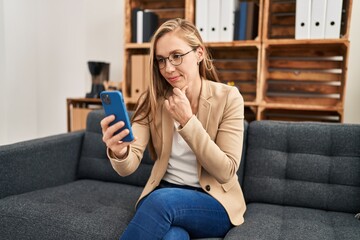 Wall Mural - Young blonde woman psychologist having online mental consultation at psychology clinic