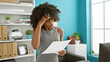 © Krakenimages.com - African american woman business worker reading document at the office