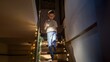 © Kyrylo Ryzhov - Excited little boy waiting for Santa Claus on Christmas eve walking down the stairs at house with flashlight. Children celebrating winter holidays.