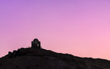 Silhouette Of A Temple On A Hillside At Sunset