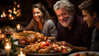 Focus on an happy white bearded grandfather with two young people around a generous dinner table with a cooked turkey and other food in a Christmas mood