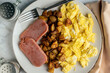 pan fried spam served with scramble egs and home fries