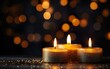 © Stormstudio - Burning candles over black background with bokeh glit fad