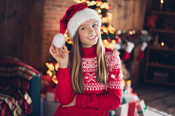 Sticker - Photo of adorable pretty little lady dressed red print pullover santa claus headwear enjoying x-mas christmas spirit indoors home room