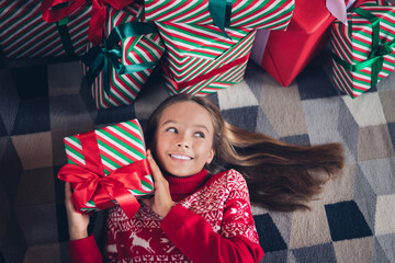 Poster - Top view photo of dreamy curious little lady dressed red print pullover lying floor guessing inside x-mas christmas gift indoors home room