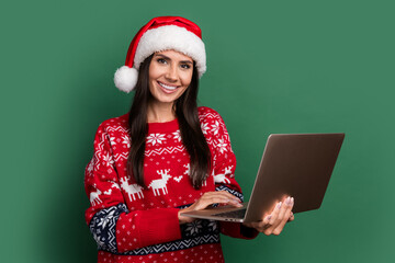 Sticker - Photo of shiny positive lady santa helper dressed print xmas sweater texting twitter telegram facebook isolated green color background