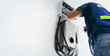 © escapejaja - Certified male Electrician Installing Home EV Charger