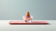  a small ice cream dish with an ice cream cone sticking out of the top of it on a pink tray.