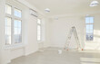 © Studio Romantic - Interior of big newly renovated apartment for rent or relocation. Spacious room with ladder, paint can, fresh white walls, large new windows, protective plastic cover on laminate floor, and no people