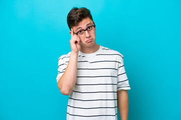 Young handsome Brazilian man isolated on blue background thinking an idea