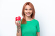 © luismolinero - Young Russian girl with an apple isolated on white background smiling a lot
