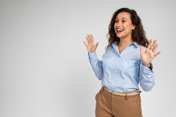 Happy shocked pretty young european woman enjoy win, surprise, celebrate success in work