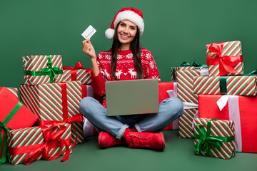 Sticker - Full body photo of cute lady sit floor feast happy new year 2024 pay cashless laptop ecard many gifts isolated on green color background