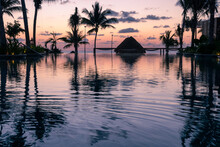 Sunrise Over The Gulf Of Mexico Reflected Into The Infinity Pool At The Resort
