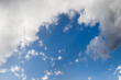 Beautiful blue sky background with fluffy white clouds