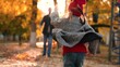 © DREAM INSPIRATION - Father and little daughter have great time spinning around in autumn park