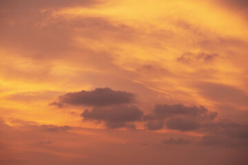 Wall Mural - Red orange cloudy sky highlighted by Sunset, tropical Thailand. Close up photo.
